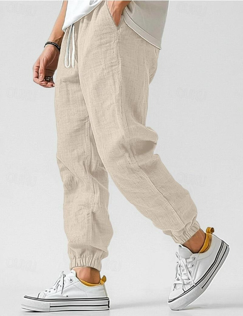 Men's textured jogger trousers with drawstring waist and elastic cuffs