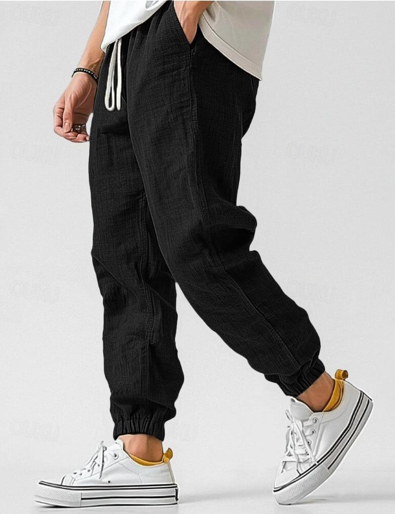 Men's textured jogger trousers with drawstring waist and elastic cuffs