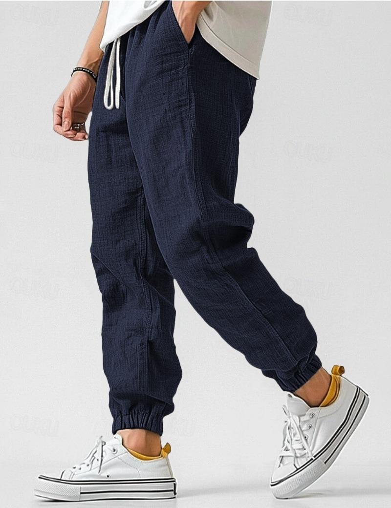 Men's textured jogger trousers with drawstring waist and elastic cuffs