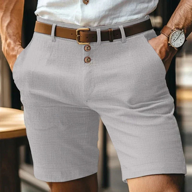 Men's mid-length chino shorts with button front and belt loops